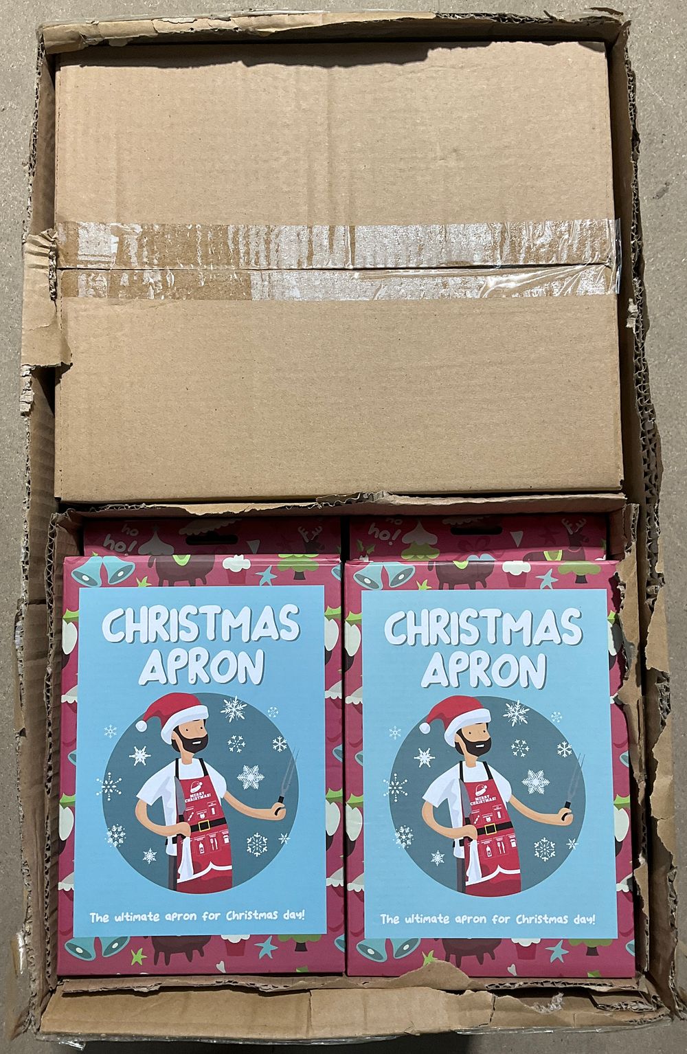 Lot 84: A Trade Carton Containing 48- Boxed Fizz Creations Ltd Christmas Aprons