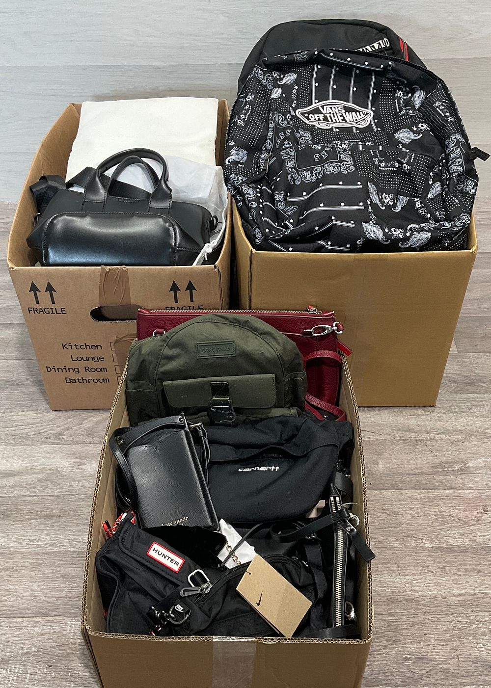 Lot 86: * 3 Cartons Containing A Collection of Assorted Handbags and Backpacks including Vans And Hunter