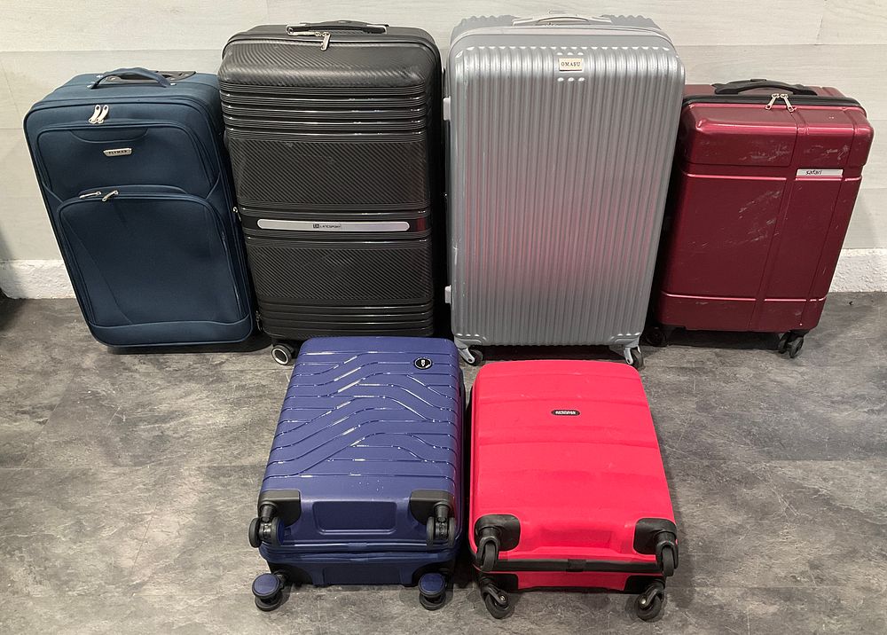Lot 112: * An Assortment of Wheeled Suitcases including Bric's and American Tourister
