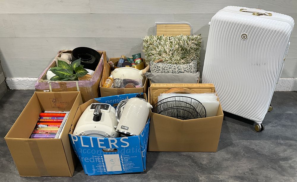 Lot 131: * An IT Luggage Suitcase & 6 Cartons Containing An Assortment of Household Goods including Breville Kitchen Appliances, and a Collection of Books