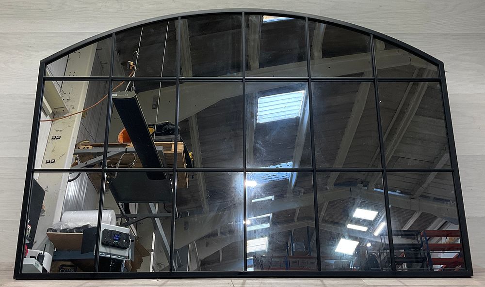 Lot 144: * A Black Arched Window Mirror