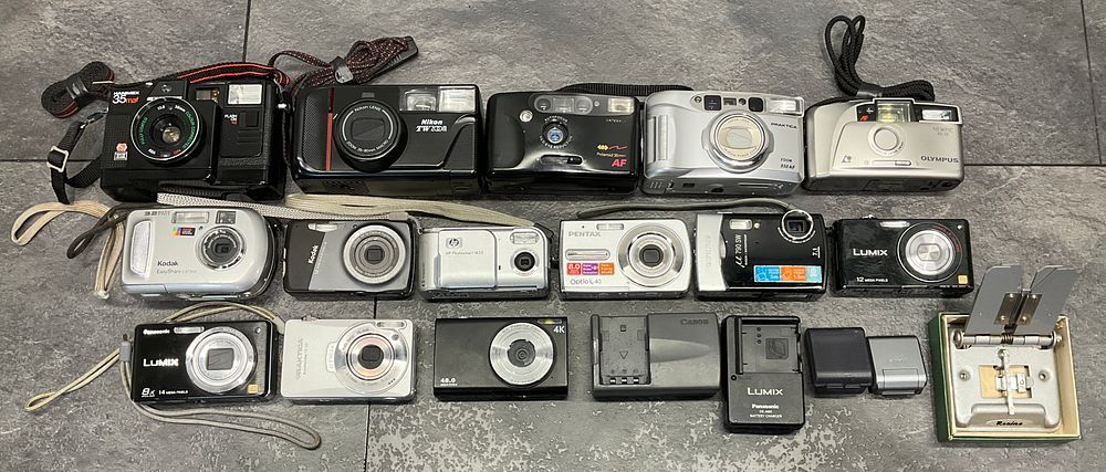 Lot 30: A Carton Containing A Collection of Assorted Film and Digital Cameras