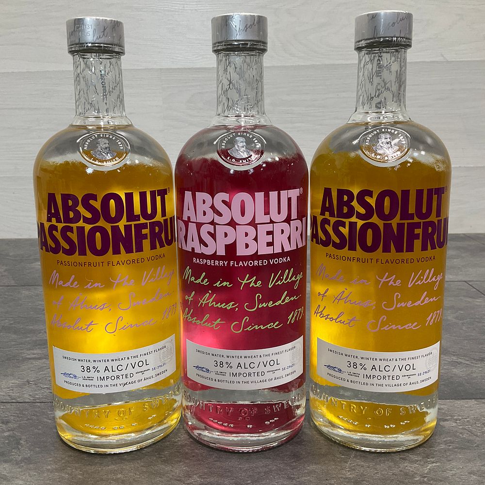 Lot 82: * Three Absolut 1-Litre Mixed Vodka Bottles