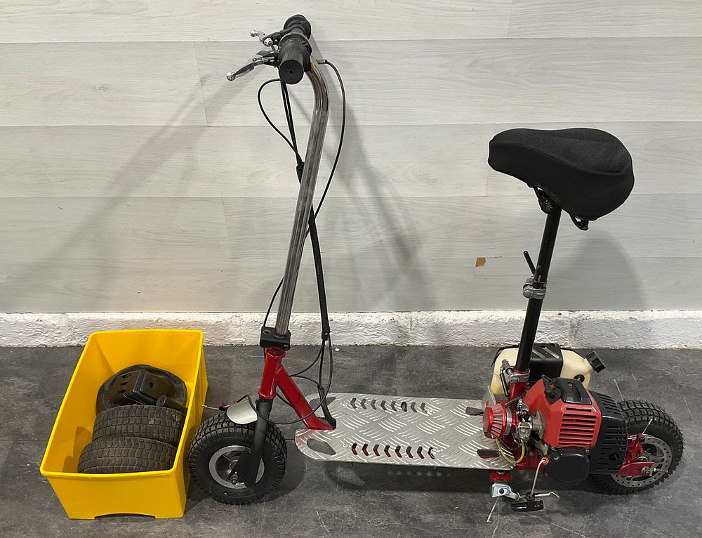 Lot 84: * A Petrol Powered Stand Up Scooter with Seat and Spares - REQUIRES ATTENTION