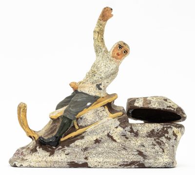 Boy Riding Sled Inkwell. German - 1925 - 4.125" Long. This is not a bank, but an inkwell. 