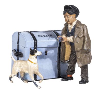 Young Man & His Dog by a Steamer Trunk Still Bank. German - 1920 - 5" T x 5" W. This is a rare 