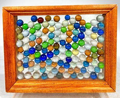 Assorted Machine-Made Marbles. In a Frame- 7" T x 9" W American- 1920 to 1950 Condition: Excellent