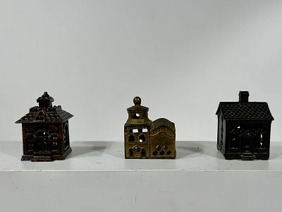 Three Cast Iron Building Banks. American 1900/1910's - Tallest is 3 1/2" Condition: Very Good to Fine