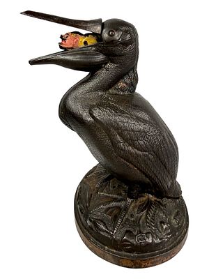 Pelican Mechanical Bank with Male Figure. Trenton Lock Company - Trenton, NJ. 1890. 8" Tall x 5 