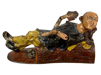 Reclining Chinaman - Cast Iron Mechanical Bank. This is a fairly scarce bank. J. &amp; E. 