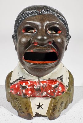 Uncle Tom Mechanical Bank with Star and Lapels - Olive Green. Kyser and Rex Co. - Philadelphia 