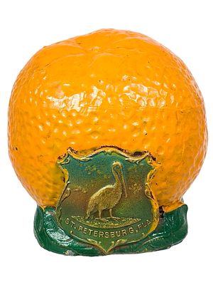 Cast Lead Orange Still Bank with St. Petersburg Medallion. American - 1940's. 3" Tall x 3" 