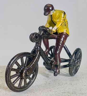 Boy on Tricycle - Cast Iron Toy. Ideal Mfg. Company. Pennsylvania 1905. 3 3/8" Tall x 4" Long. 