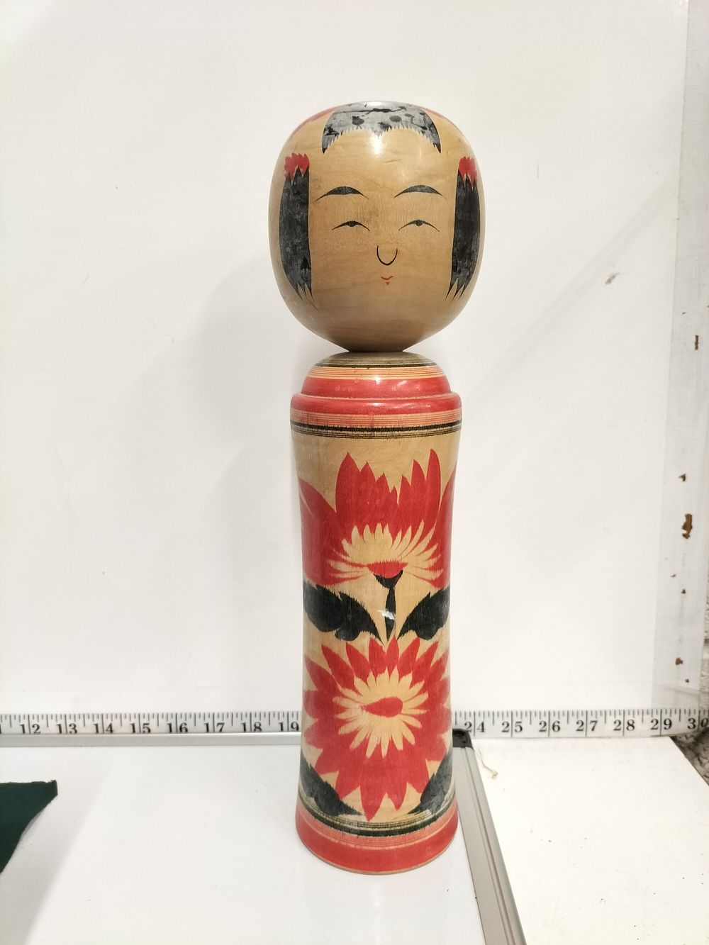 Lot 193 – Hiroshi Kakinuma, Traditional Naruko Style Kokeshi Doll, Mid-20th Century, Hand-Painted Chrysanthemum Decoration