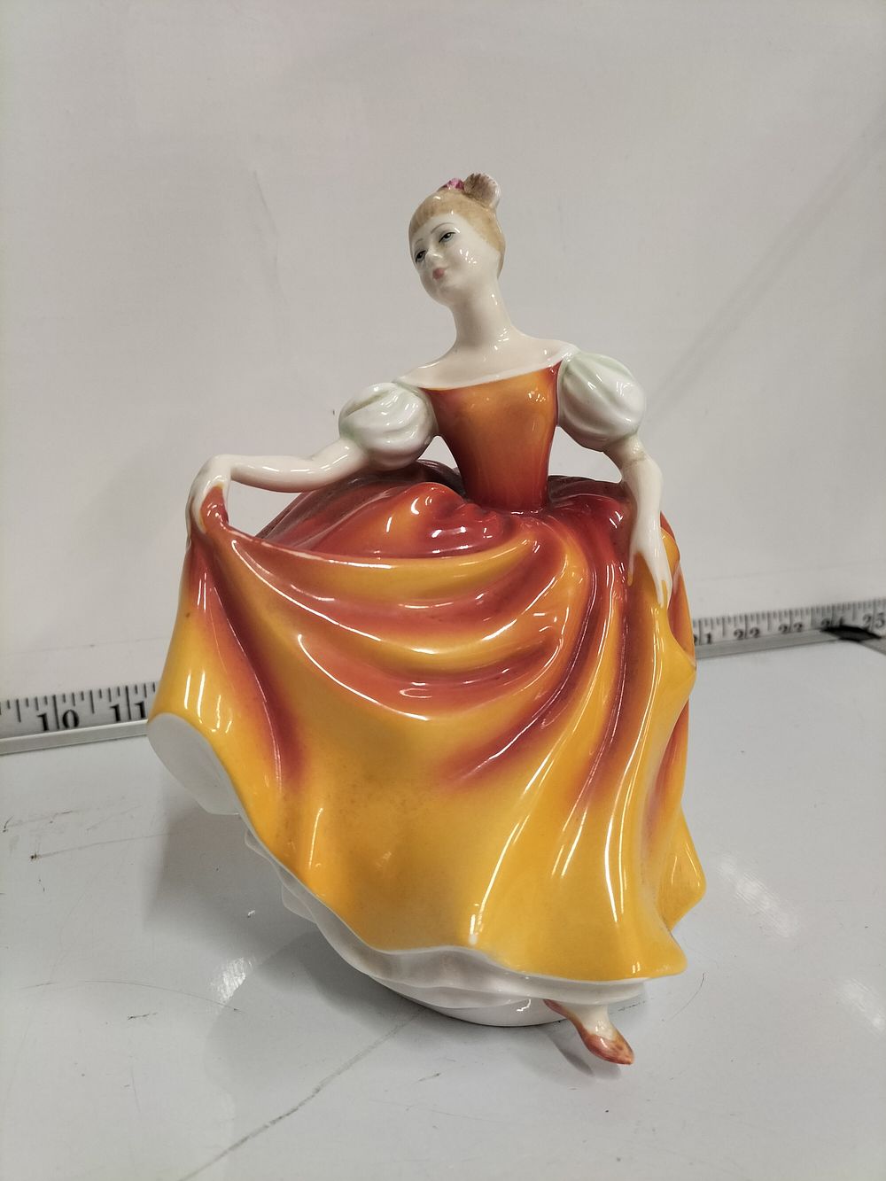 Lot 221 – Royal Doulton, Autumn Attraction Figurine