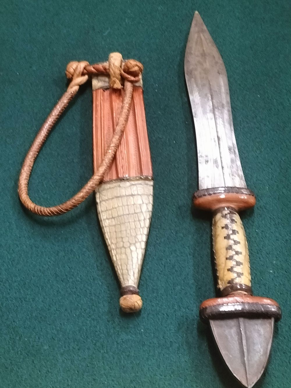 Lot 244 – Unmarked, Sudanese Arm Dagger, Lizard Skin and Leather