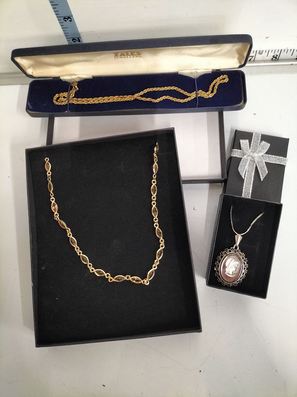 Lot 253 – A Selection of Three Yellow and Silver-Toned Necklaces including a Cameo Pendant and Marquise-Cut Stone-Set Chain