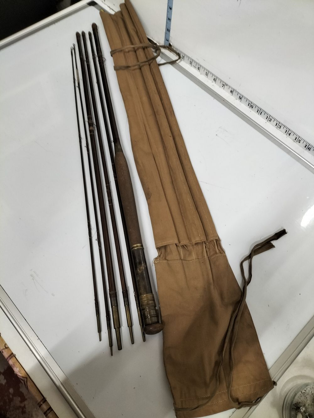 Lot 177 – A Vintage Multi-Piece Wood and Brass Fly Fishing Rod Set with Canvas Sleeve