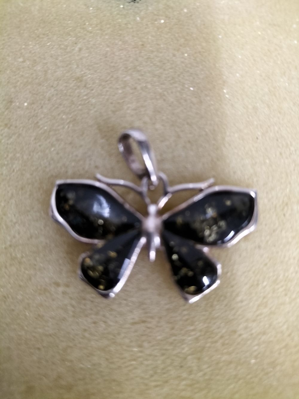 Lot 253 – Silver and Amber Pendant in the shape of a butterfly