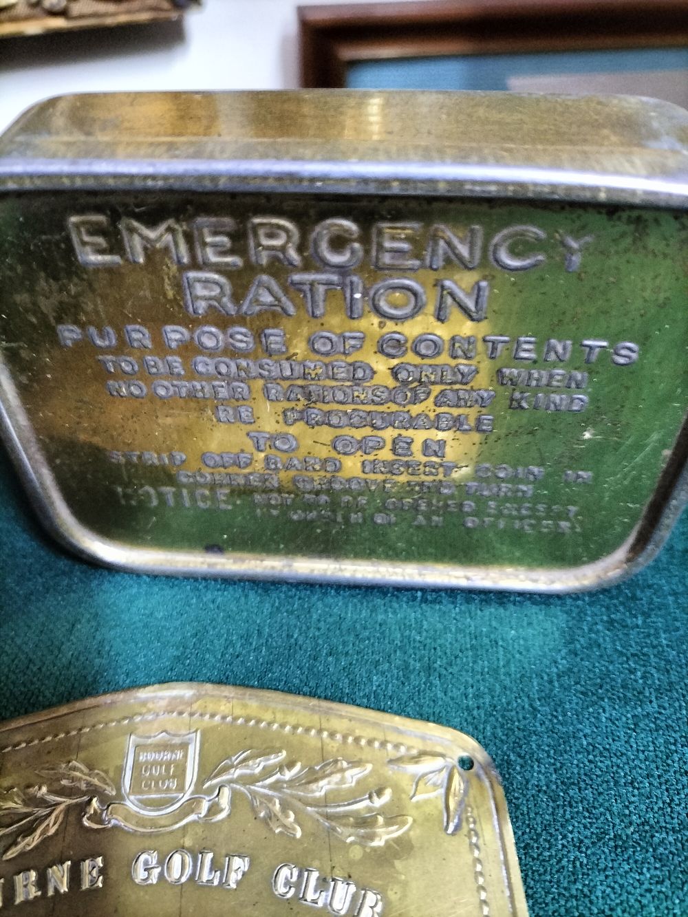 Lot 158 – Two Collectable Metal Items Including a Second World War Period British Military Emergency Ration Tin and a Novelty Golf Plaque