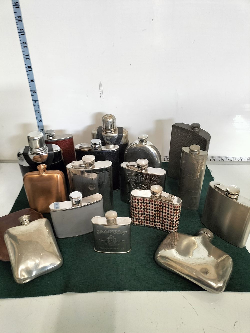 Lot 182 – A Collection of Stainless Steel and Pewter Hip Flasks including Branded Jameson and Jack Daniel’s Examples