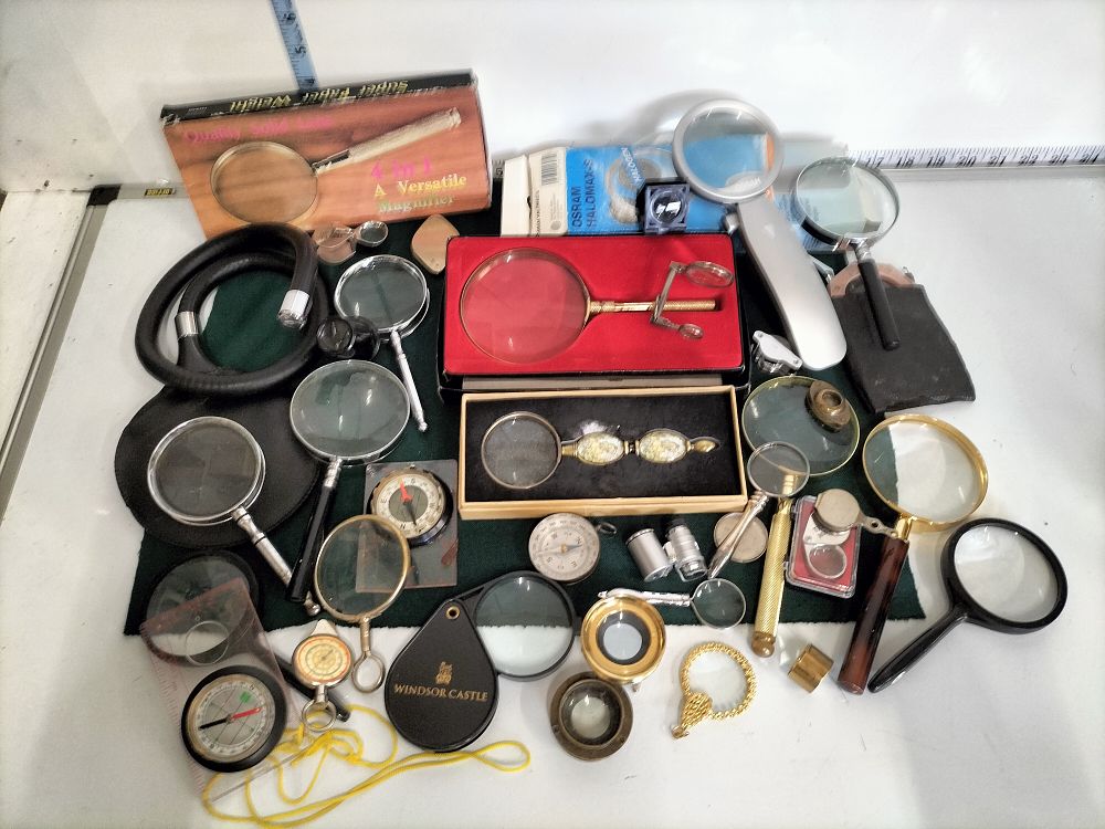 Lot 200 – An Assortment of Approximately 25 Optical Instruments, Magnifying Glasses, and Navigational Aids