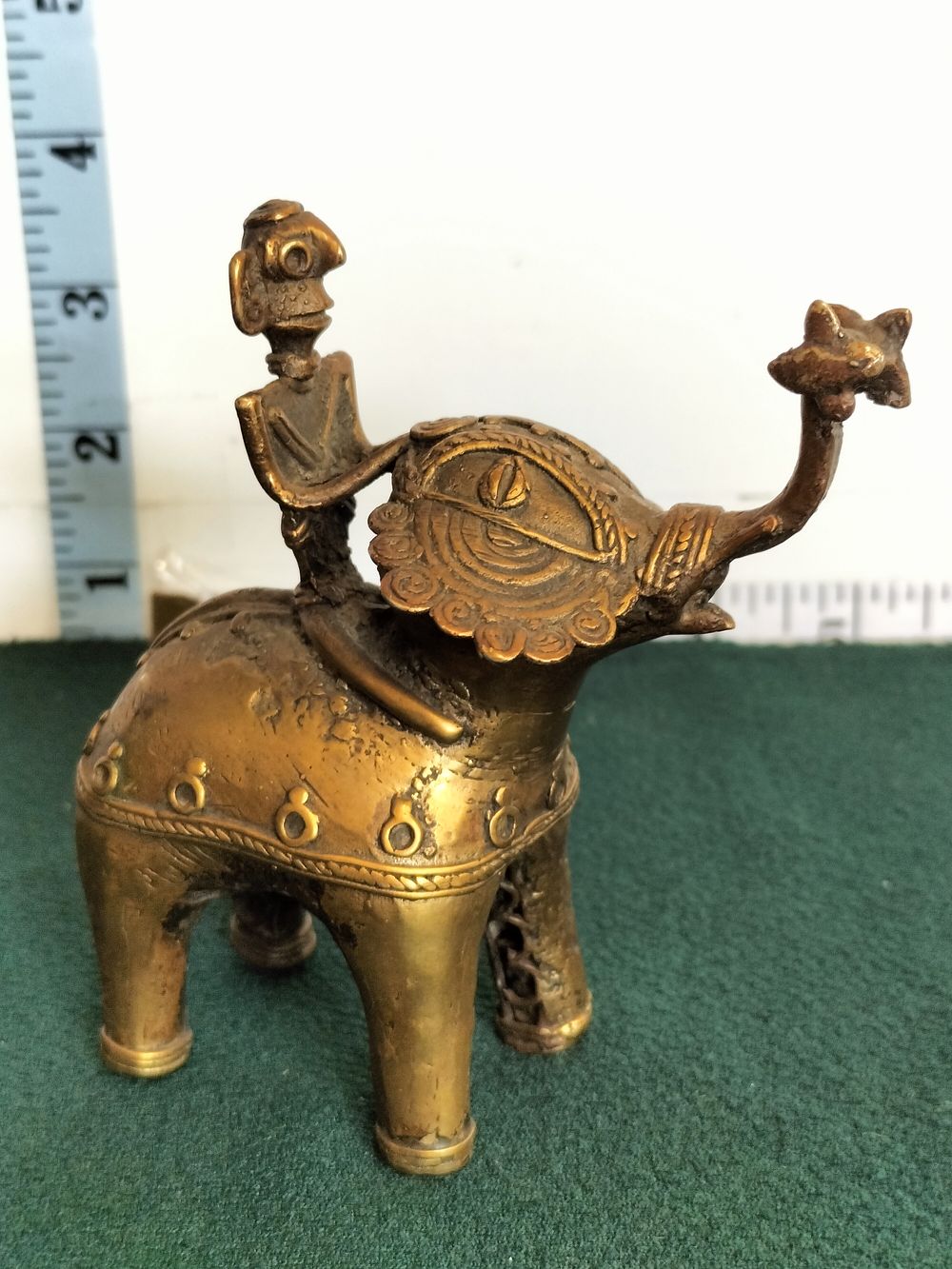 Lot 217 – An Indian Dhokra Cast Copper-Alloy Figurine of an Elephant and Rider
