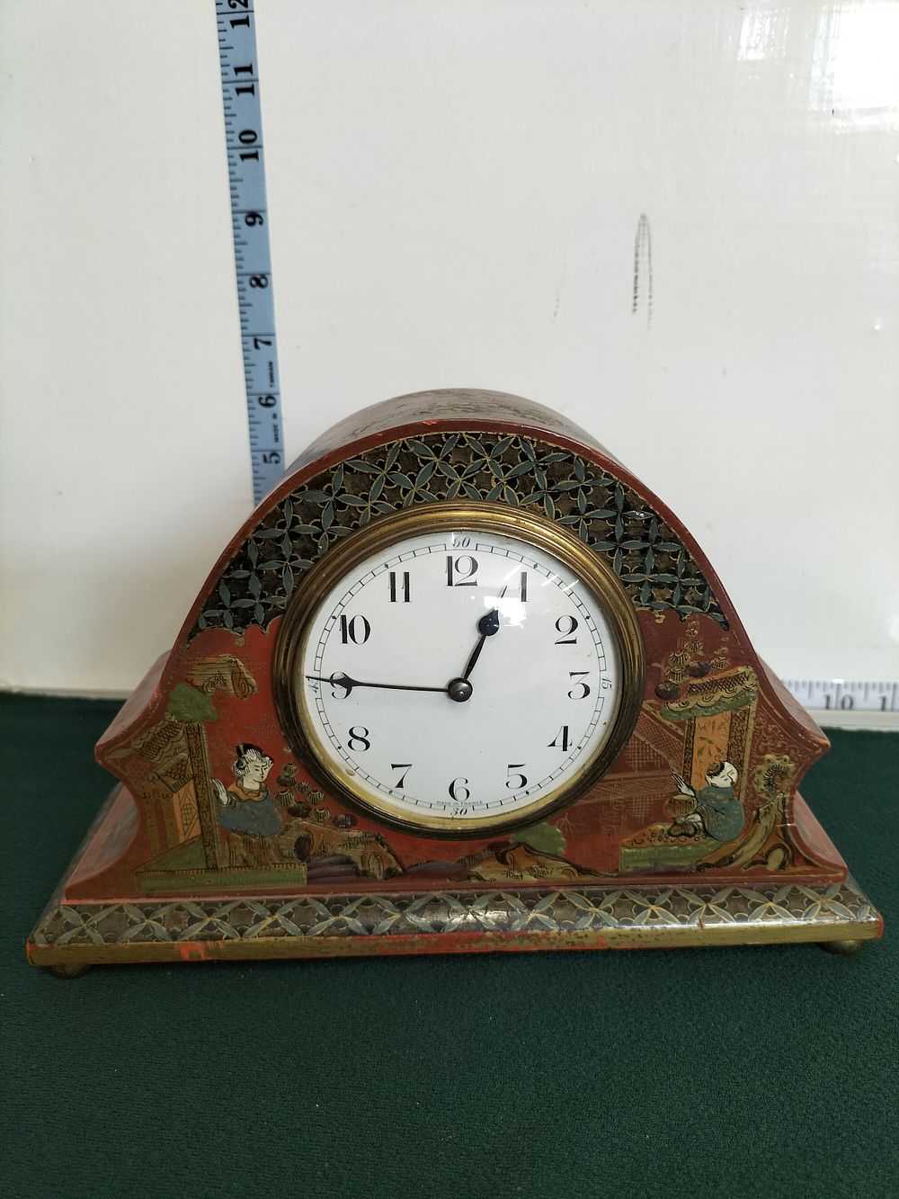 Lot 221 – An Early 20th Century French Chinoiserie Red Lacquered Napoleon Hat Mantel Clock