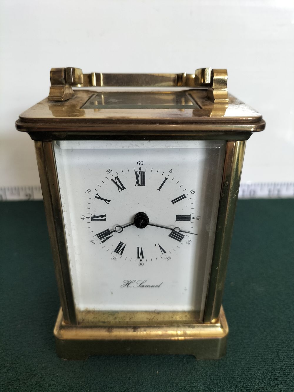 Lot 224 – An H. Samuel English brass-cased mechanical carriage clock