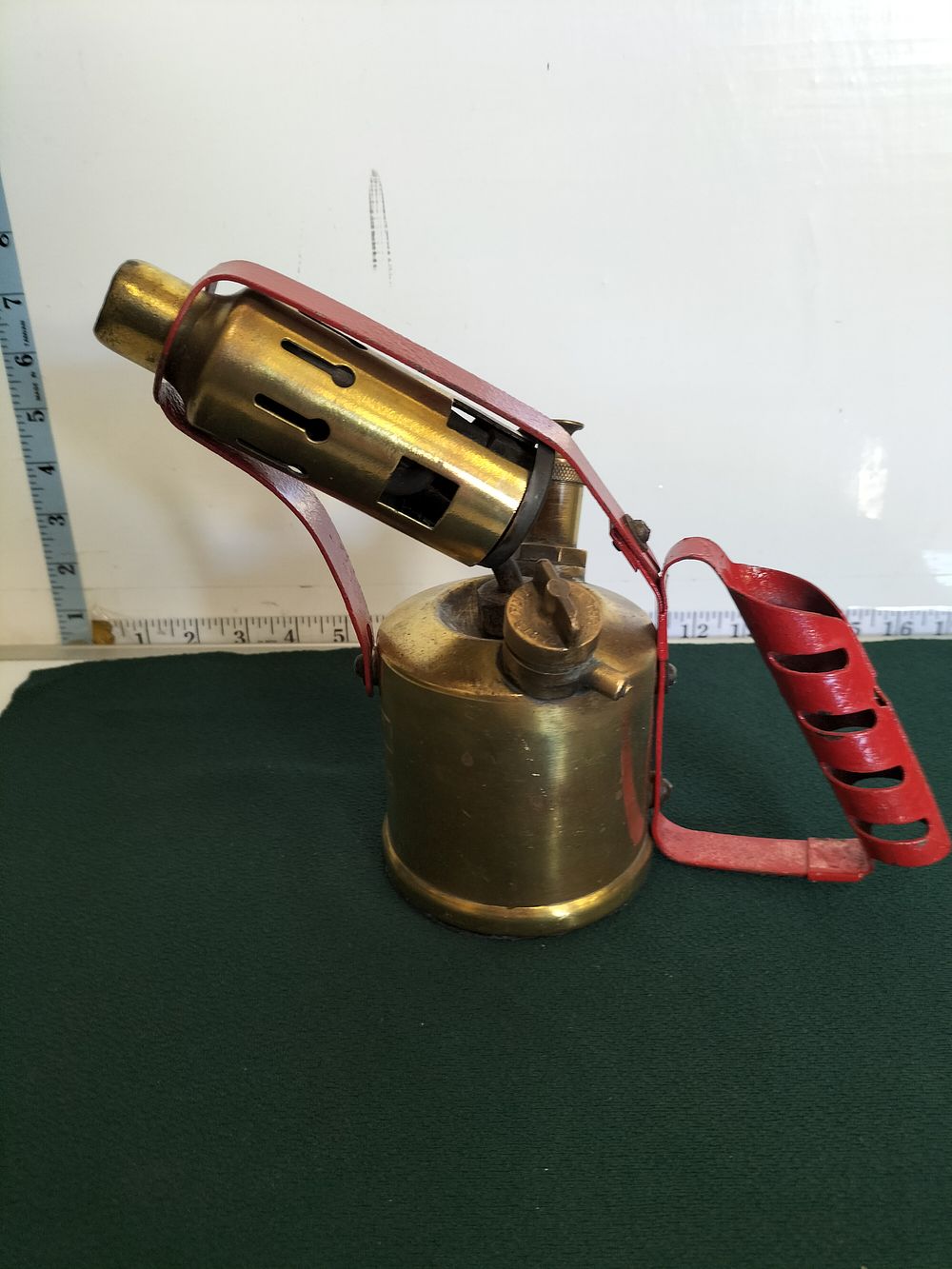 Lot 244 – A Mid-20th Century Brass and Red-Painted Steel Pressurised Blowtorch