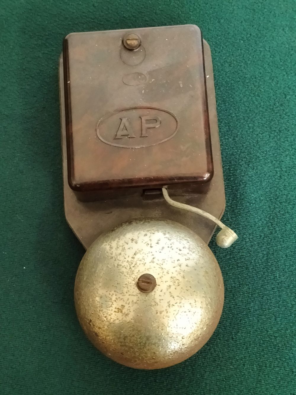 Lot 264 – A mid-20th century mottled brown Bakelite electric bell with AP mark