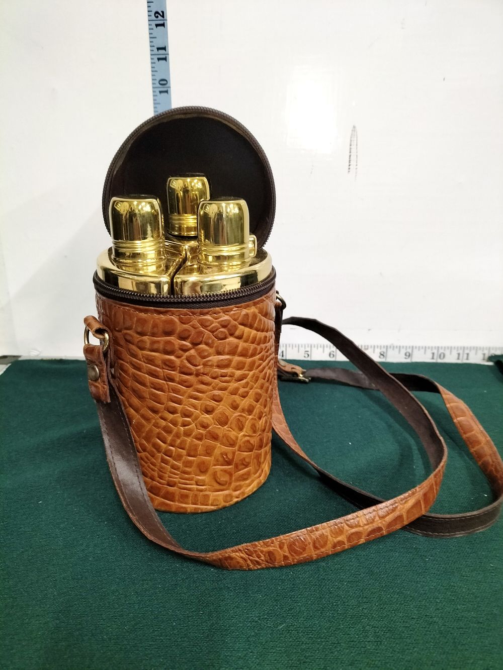 Lot 286 – A Trio of Mid-20th Century Glass Spirit Flasks in an Embossed Travel Case