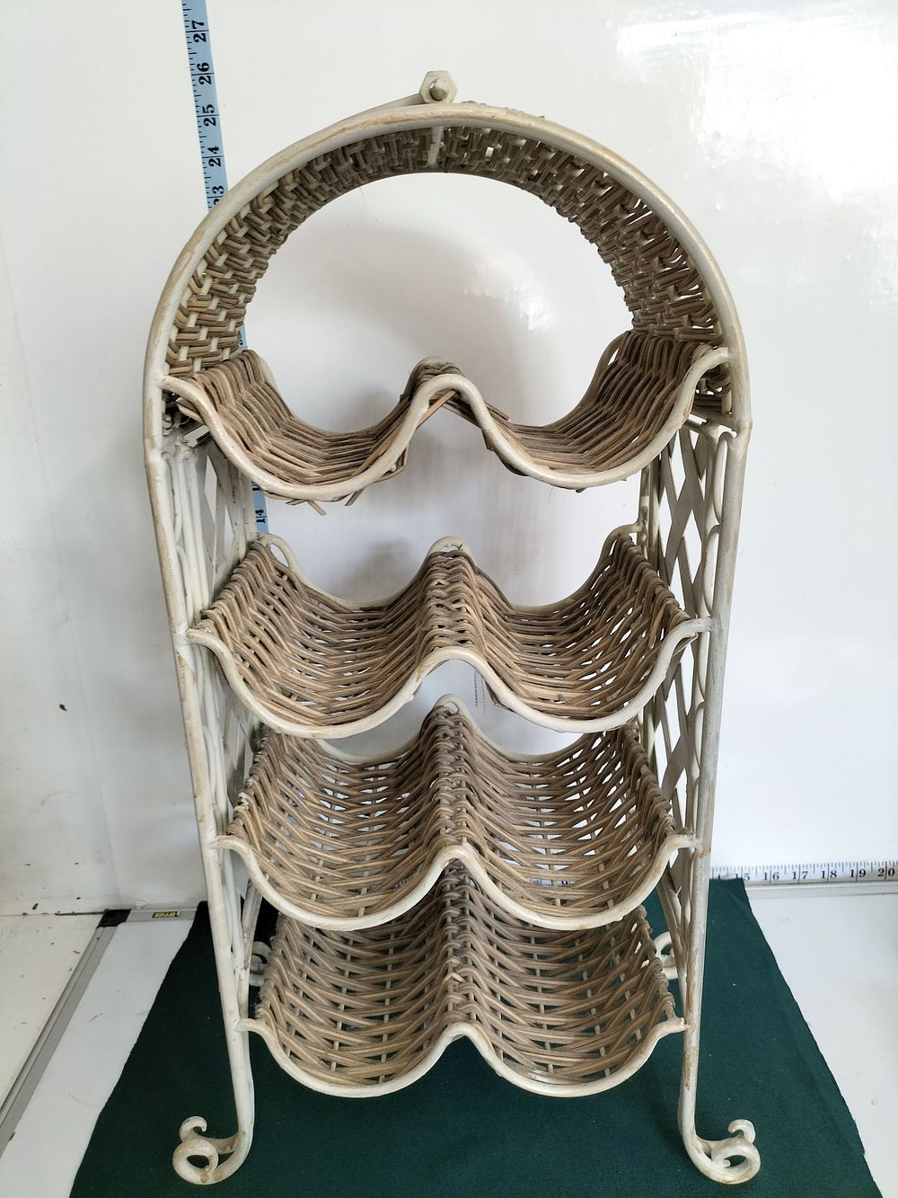 Lot 300 – Wrought Iron and Woven Wicker Four-Tier Arched Wine Rack