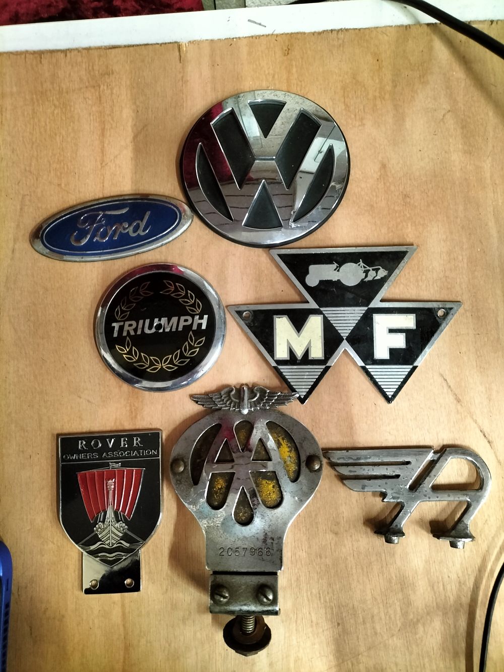 Lot 157 – A Collection of Vintage Automotive and Agricultural Grille Badges and Emblems