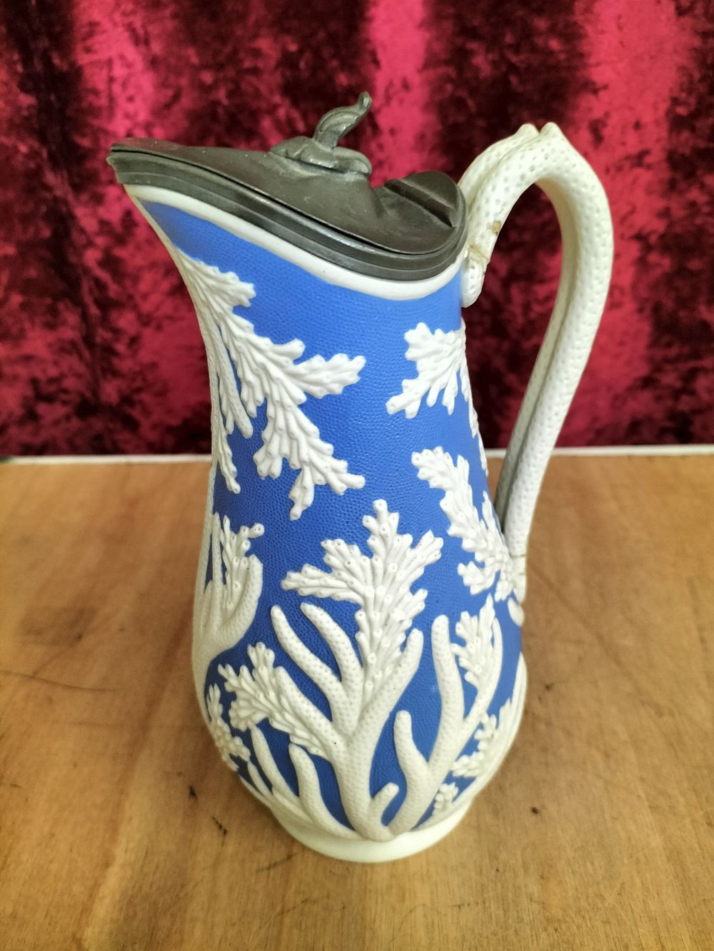 Lot 209 – Victorian relief-moulded stoneware lidded jug in a coral pattern