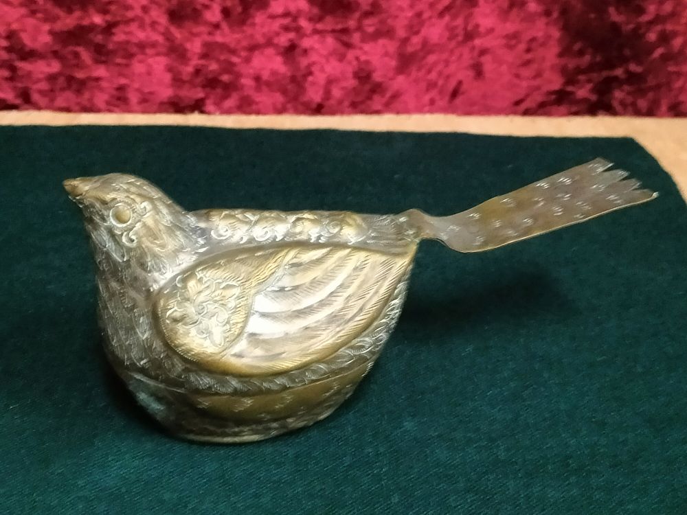 Lot 182 – An Indian Chased Brass Bird-Shaped Container