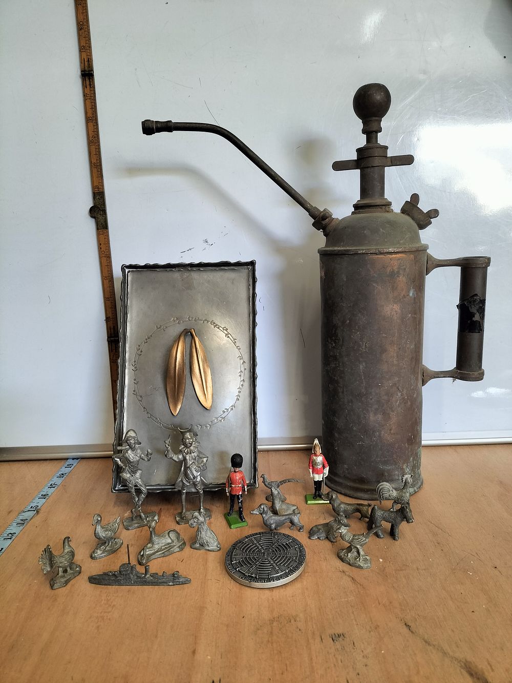 Lot 168 – A Peltro Nani Pewter Box, a Vintage Copper Pressure Sprayer, and a Collection of 17 Miniature Figures and Objects