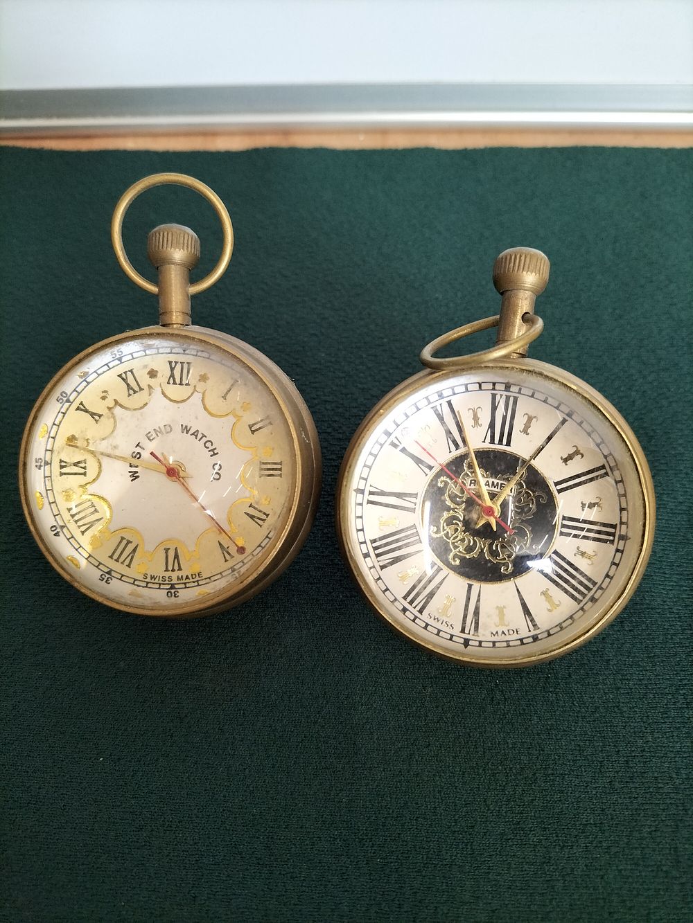 Lot 171 – A Pair of Vintage Swiss Brass Ball-Form Pendant Watches