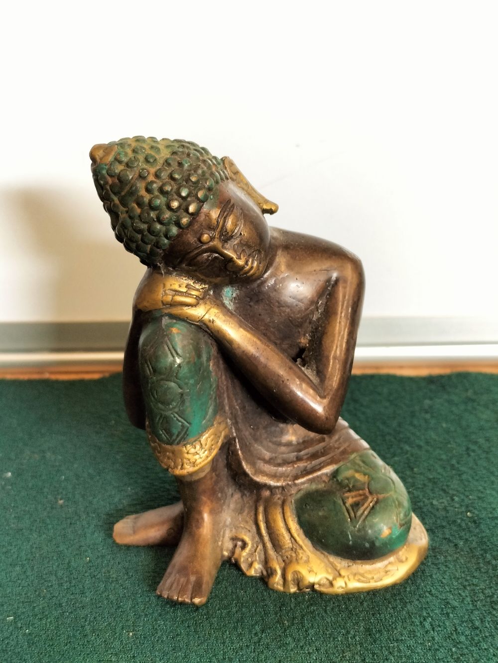 Lot 200 – A Southeast Asian Bronze Figurine of a Resting Buddha