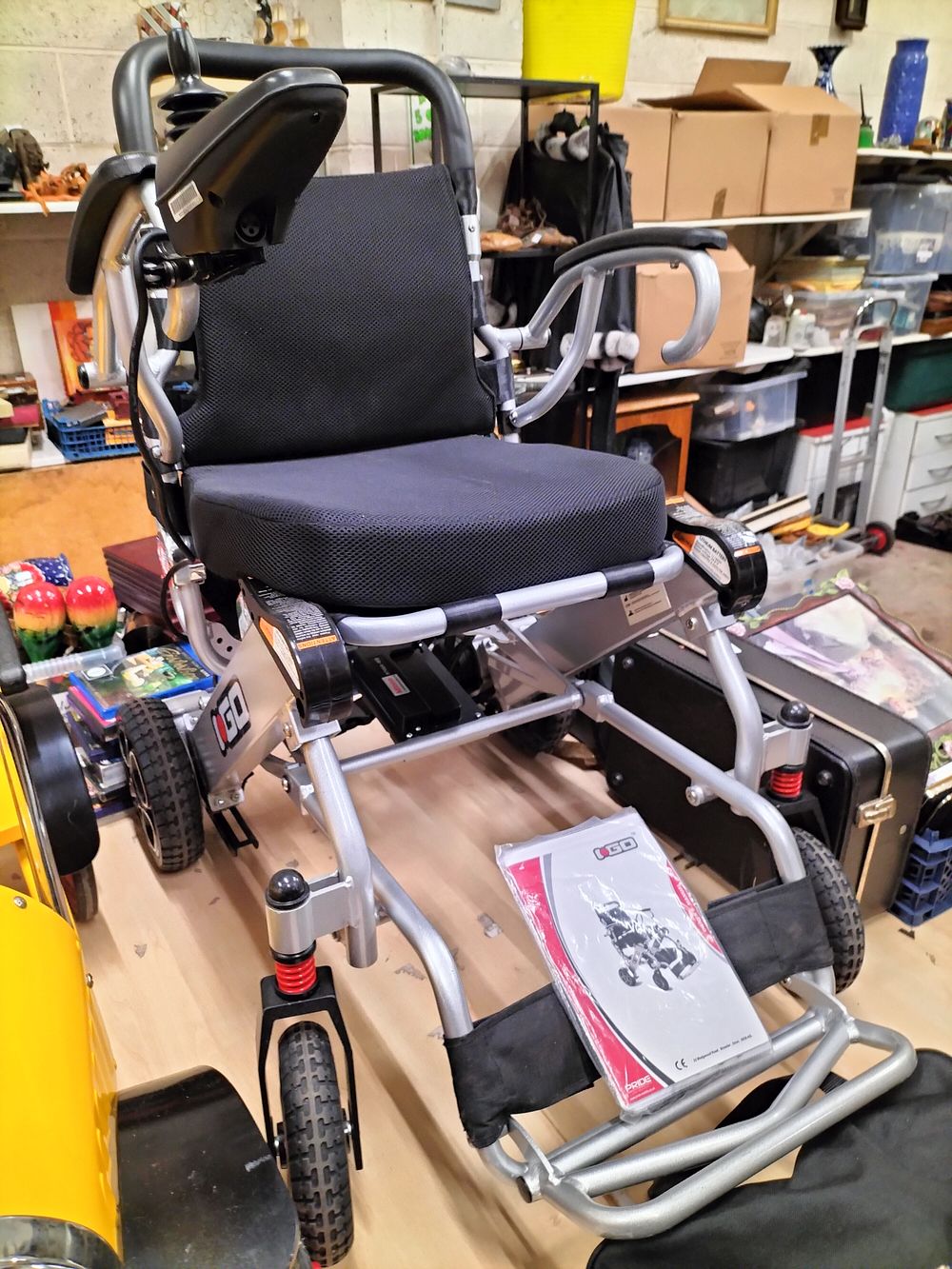 Lot 203 – Pride Mobility i-Go Folding Electric Power Wheelchair