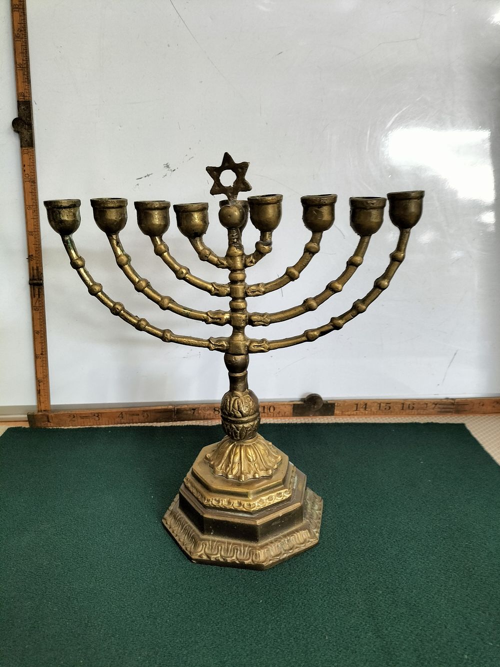 Lot 153 – A Vintage Cast Brass Nine-Branch Hanukkah Menorah with Star of David Finial
