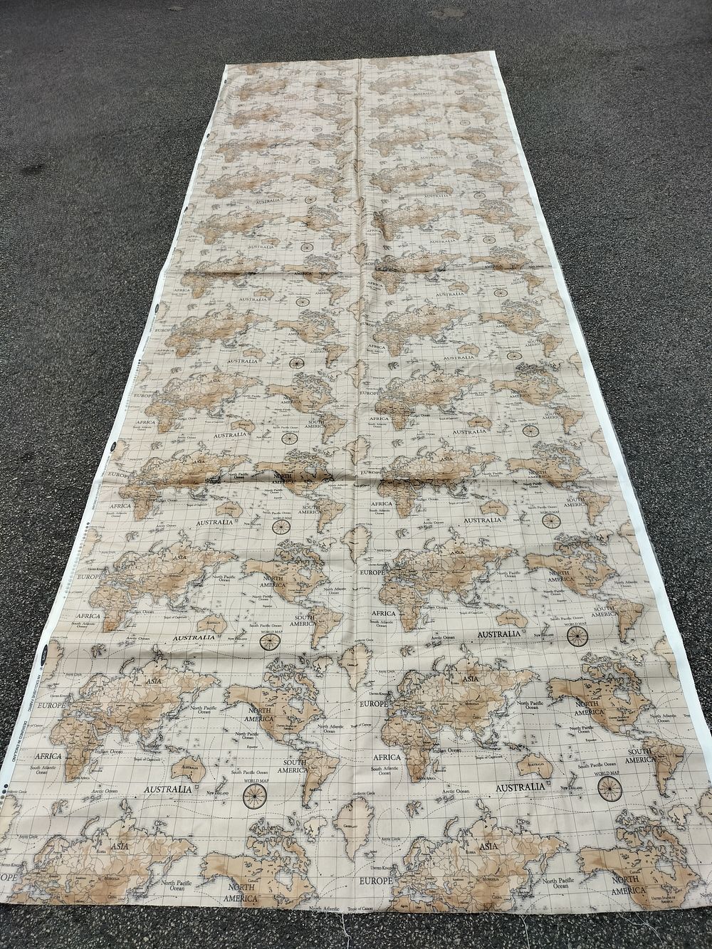 Lot 156 – A Large Length of Vintage Style World Map Patterned Furnishing Fabric