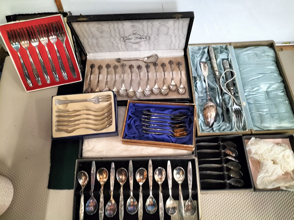 Lot 158 – A Collection of Seven Cased Silver-Plated and White Metal Flatware Sets