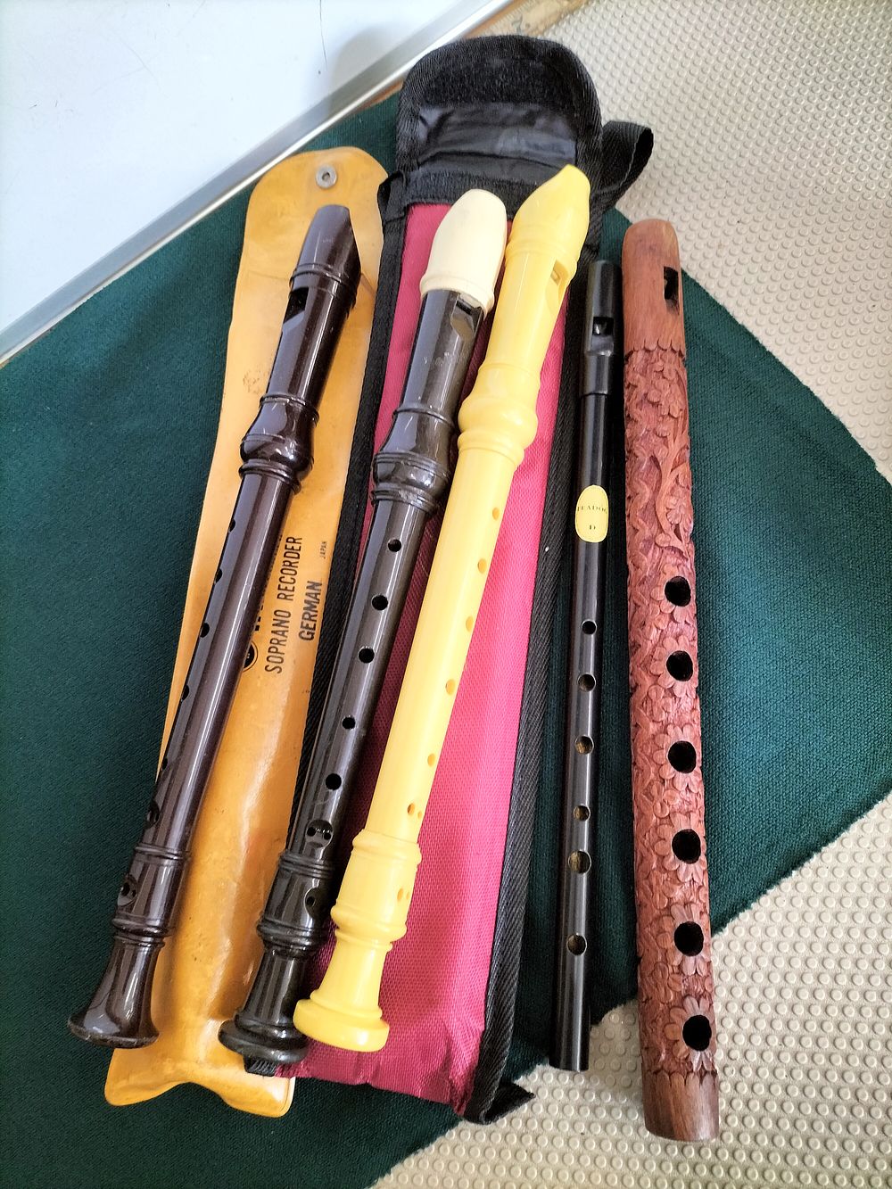 Lot 171 – A Collection of Soprano Recorders, a Feadóg Tin Whistle, and a Carved Wooden Flute