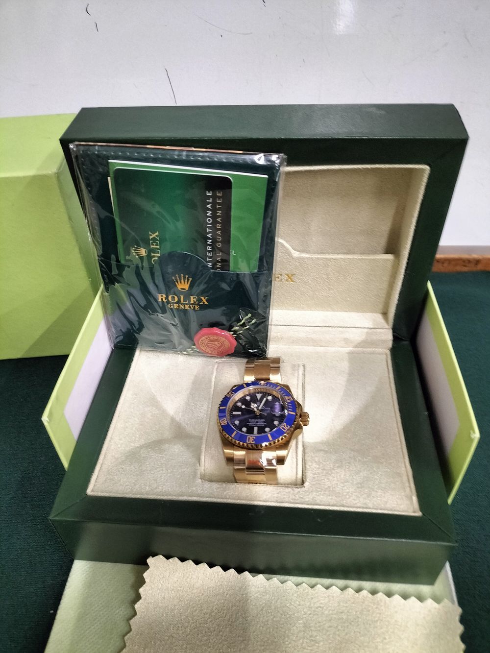Lot 186 – Super Clone Rolex Oyster Perpetual Date Submariner Gold-Toned Wristwatch with Original Packaging