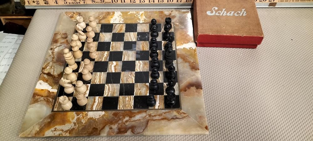Lot 165 – A Vintage Hand-Carved Chess Set with Original Storage Box