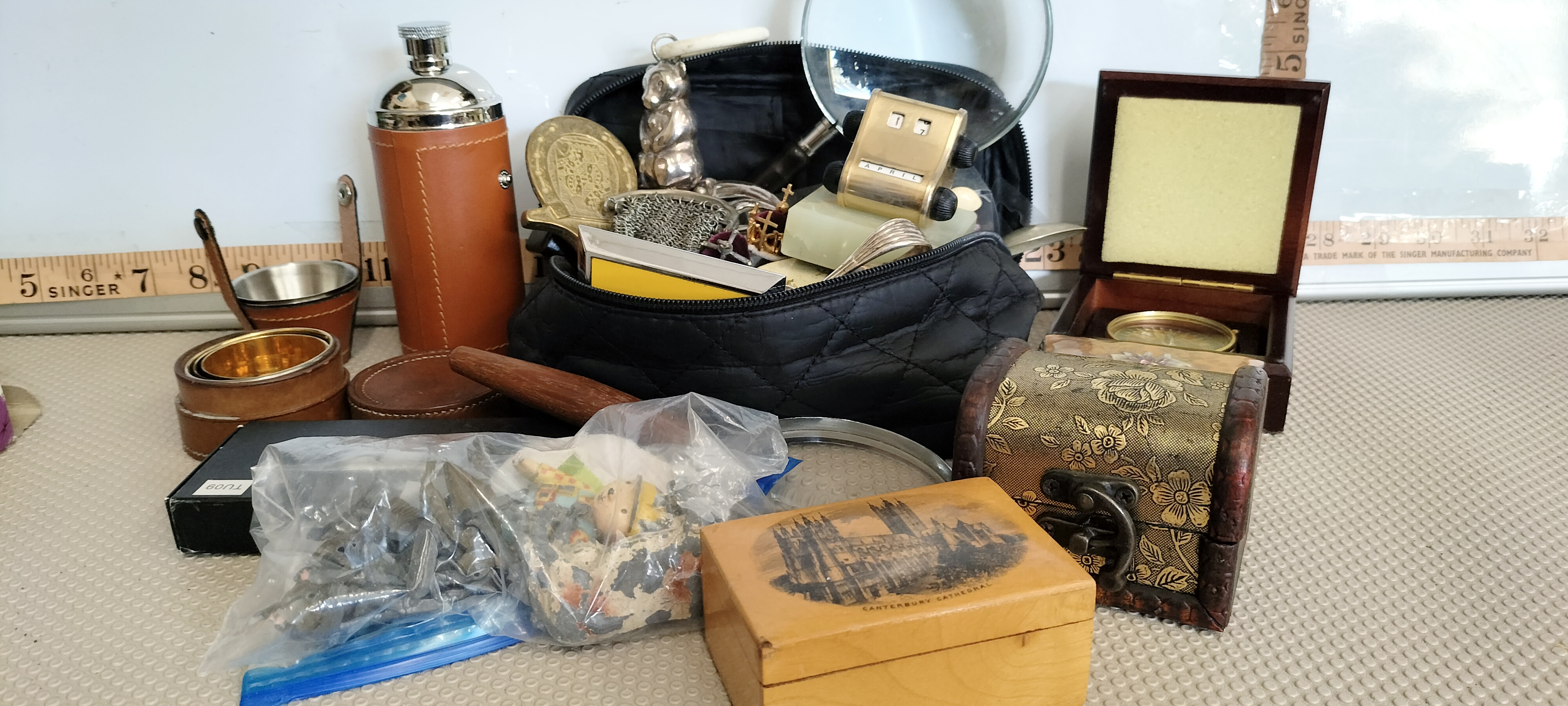 An Assortment of Vintage Collectables and Personal Effects including a Hip Flask, Desk Calendar, and Compass