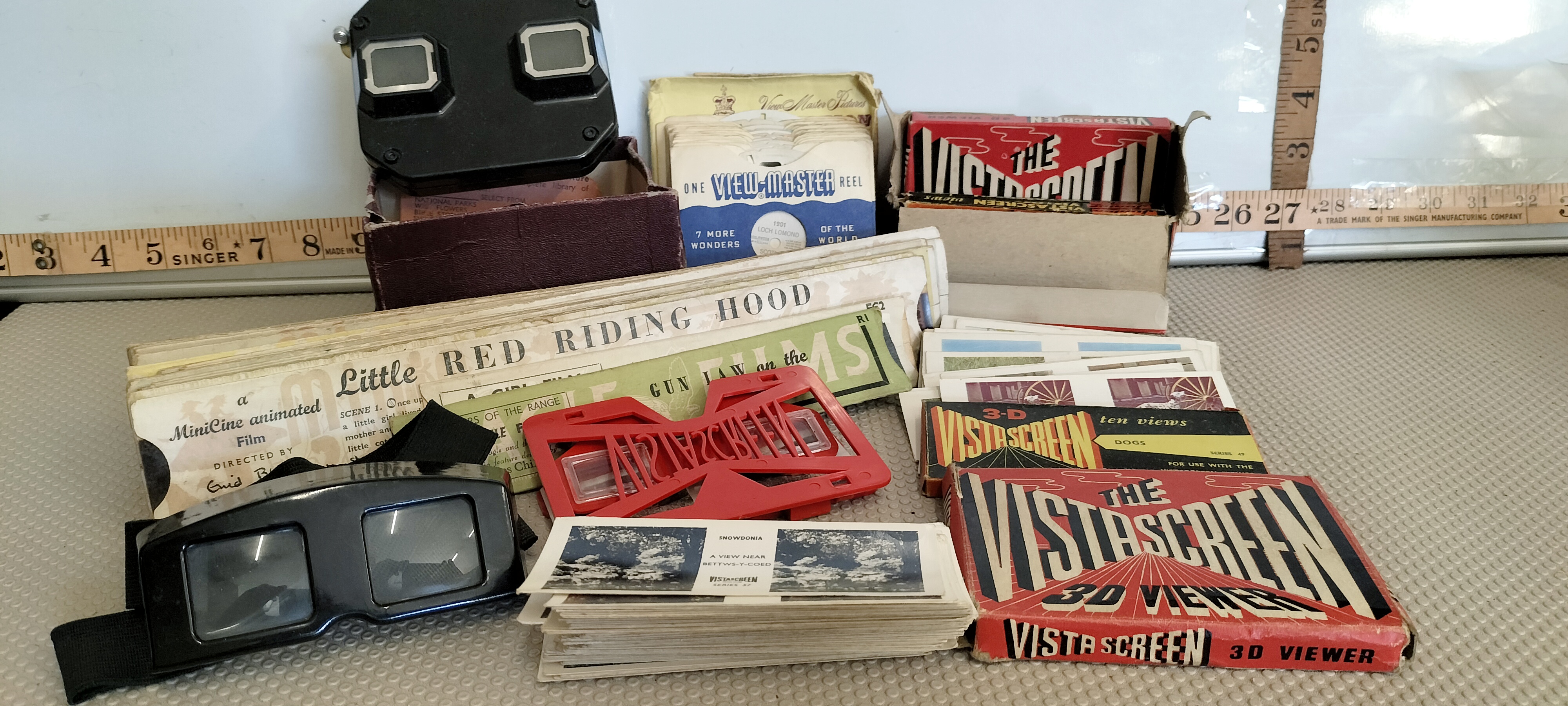 A Collection of Vintage Stereoscopic Viewers and Media including Sawyer's View-Master and VistaScreen