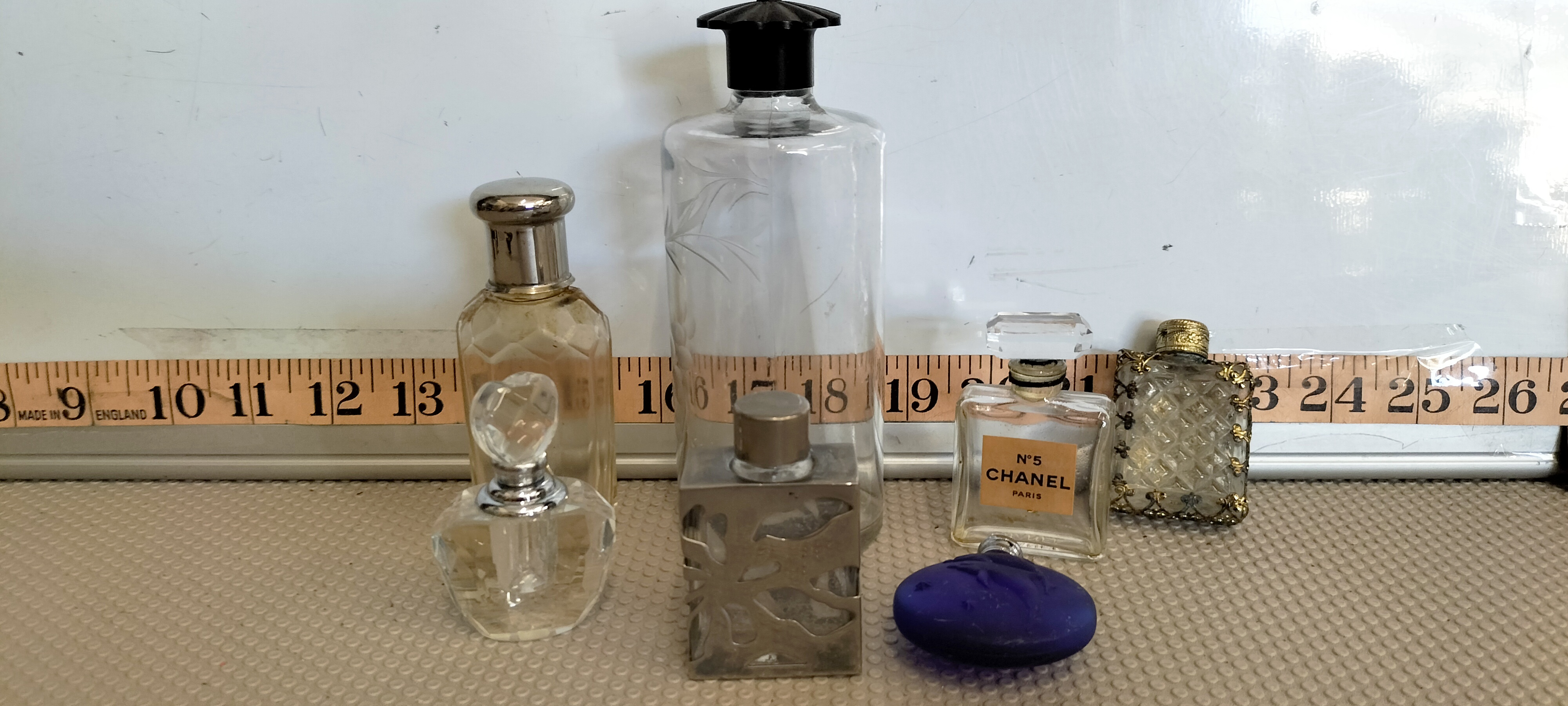 A Collection of Seven Vintage and Antique Glass Scent and Perfume Bottles including Chanel No. 5