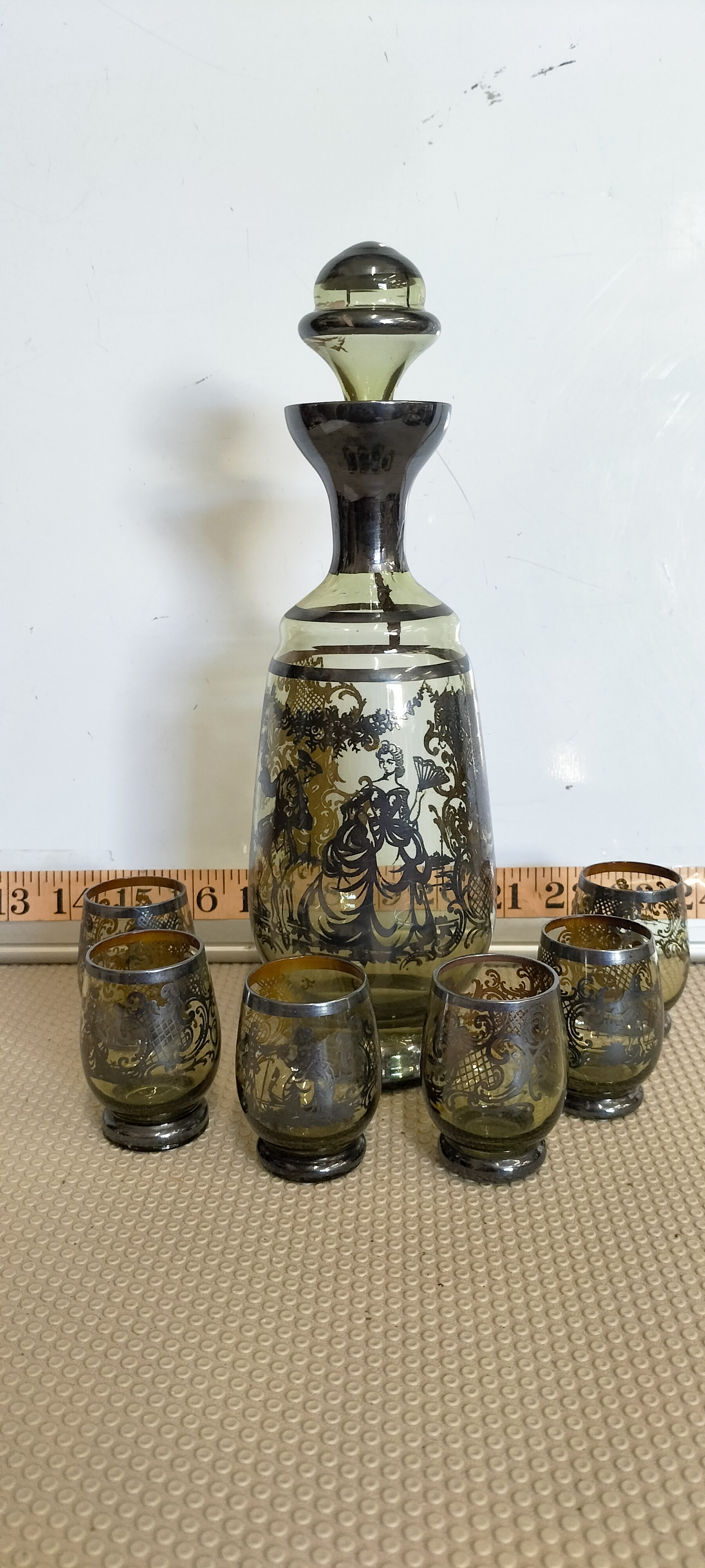 A Seven Piece Venetian Style Smoked Glass Liqueur Set with Silver Overlay